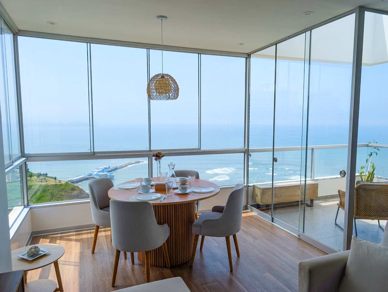 Dining table inside the wraparound glass corner