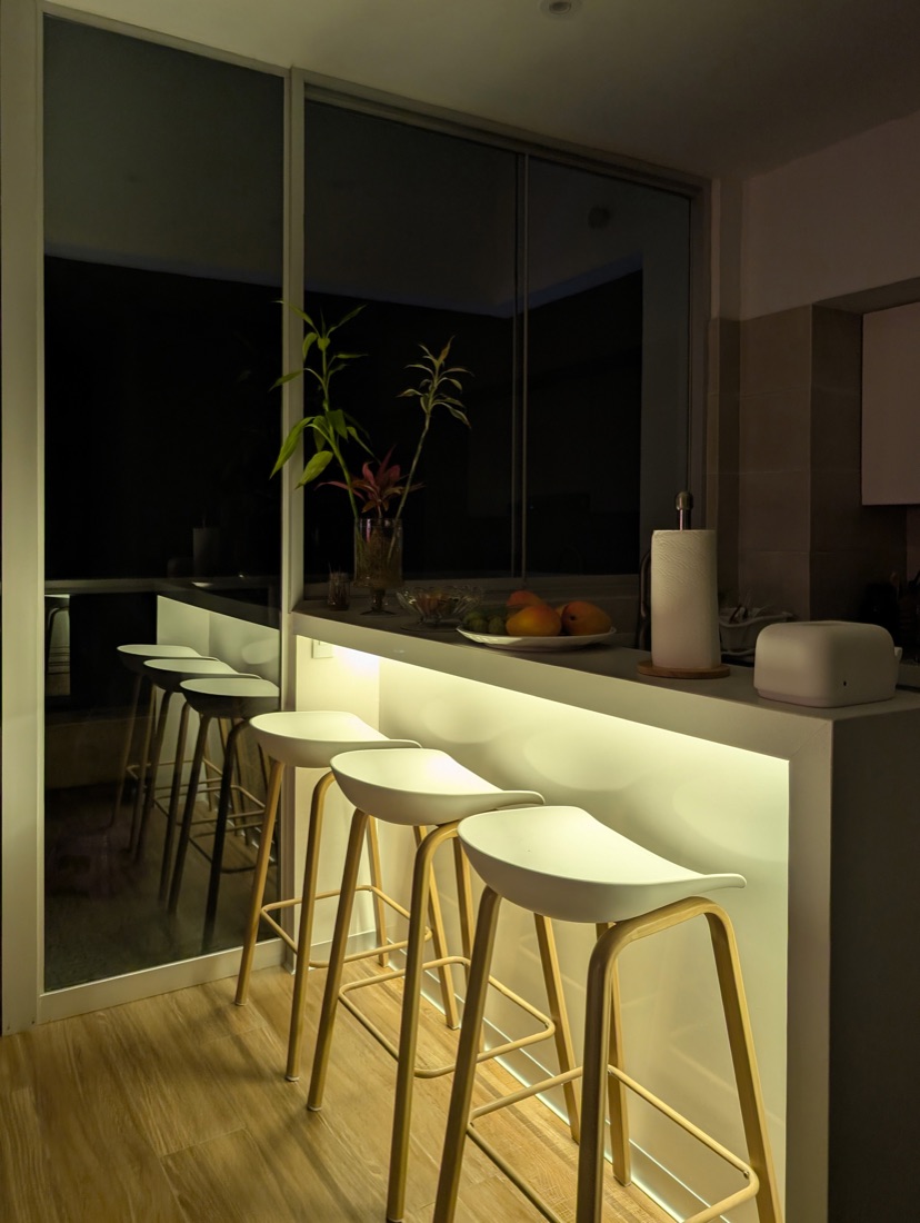 Breakfast bar at night with warm under-lighting